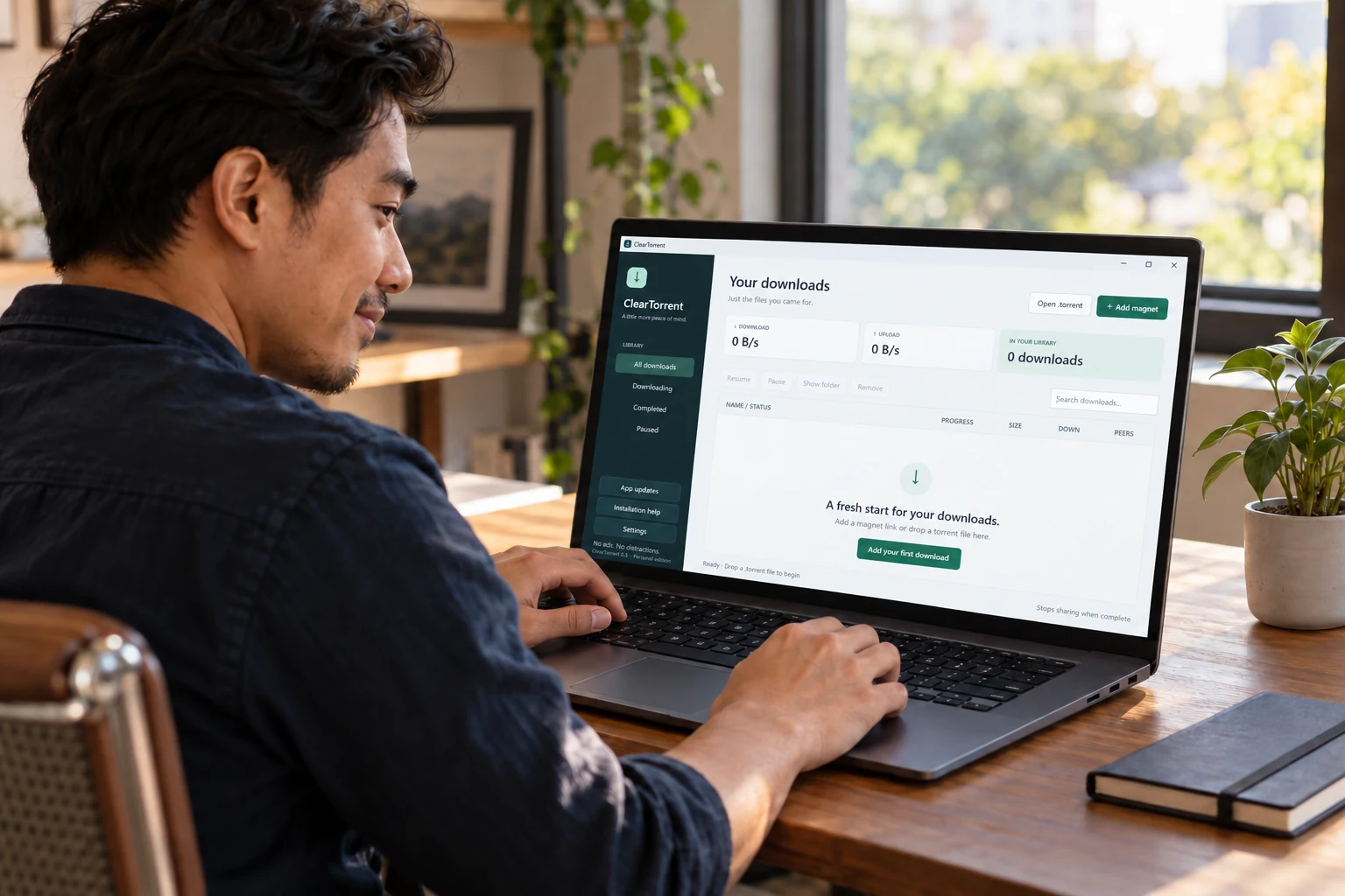 Illustration of a man using ClearTorrent on a Windows laptop at home